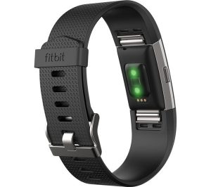 Fitbit watch showing the heart rate monitor lights
